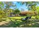 Spacious backyard with lush lawn and lounge chairs at 3901 Balsam Ct, Sarasota, FL 34243