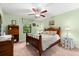 Cozy guest bedroom featuring a queen-size bed and a ceiling fan at 3901 Balsam Ct, Sarasota, FL 34243