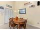 Cozy breakfast nook with wood table and chairs, adjacent to kitchen at 3901 Balsam Ct, Sarasota, FL 34243