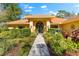 House with double front doors and manicured landscaping at 3901 Balsam Ct, Sarasota, FL 34243