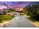 Luxury home with a long driveway and palm trees at 3901 Balsam Ct, Sarasota, FL 34243