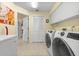 Bright laundry room with cabinets and extra storage at 3901 Balsam Ct, Sarasota, FL 34243