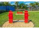 Dog park with agility features and fire hydrant-themed obstacles at 4905 Avila Lakes Dr, Wimauma, FL 33598