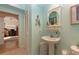 Charming bathroom with pedestal sink and stylish decor at 5392 Gulf Dr, Holmes Beach, FL 34217