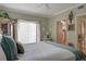 Spacious bedroom with large window and access to balcony at 5392 Gulf Dr, Holmes Beach, FL 34217