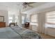 Main bedroom with large windows and comfortable bedding at 5392 Gulf Dr, Holmes Beach, FL 34217