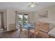 Dining area with glass-top table and wicker chairs near balcony at 5420 Swift Rd # 38, Sarasota, FL 34231