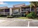 Condo building with parking and lush landscaping at 5420 Swift Rd # 38, Sarasota, FL 34231