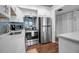 Modern kitchen with white cabinets and stainless steel appliances at 5420 Swift Rd # 38, Sarasota, FL 34231