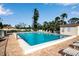 Community pool area with lounge chairs for sunbathing at 5420 Swift Rd # 38, Sarasota, FL 34231