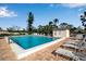 Community pool with plenty of lounge chairs for relaxing at 5420 Swift Rd # 38, Sarasota, FL 34231