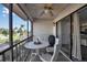 Screened porch with outdoor seating and a view of the pool at 5420 Swift Rd # 38, Sarasota, FL 34231