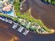 Aerial view of waterfront community with marina, pool, and lush landscaping at 608 Misty Pond Ct, Bradenton, FL 34212