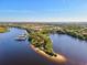 Aerial view of waterfront homes and marina at 608 Misty Pond Ct, Bradenton, FL 34212