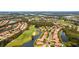 Bird's-eye perspective of a waterfront community near a golf course at 608 Misty Pond Ct, Bradenton, FL 34212