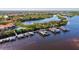 Aerial view of community with marina, waterfront homes, and lush landscaping at 608 Misty Pond Ct, Bradenton, FL 34212