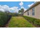 Landscaped backyard with a privacy fence and lush greenery at 608 Misty Pond Ct, Bradenton, FL 34212