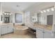 Elegant bathroom with double vanity and soaking tub at 608 Misty Pond Ct, Bradenton, FL 34212