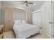 Guest bedroom with a queen bed and built-in cabinets at 608 Misty Pond Ct, Bradenton, FL 34212