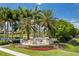 Waterlefe Golf & River Club entrance with palm trees and landscaping at 608 Misty Pond Ct, Bradenton, FL 34212