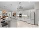 Modern kitchen with white cabinets, granite counters, and island at 608 Misty Pond Ct, Bradenton, FL 34212