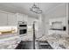 Modern kitchen sink with granite countertop and stainless steel faucet at 608 Misty Pond Ct, Bradenton, FL 34212