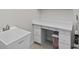 Laundry room with utility sink and built-in cabinets at 608 Misty Pond Ct, Bradenton, FL 34212