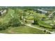 Aerial view showing a lush green golf course at 6440 Mourning Dove Dr # 403, Bradenton, FL 34210