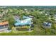 Aerial view of community clubhouse, pool, and surrounding landscape at 6440 Mourning Dove Dr # 403, Bradenton, FL 34210