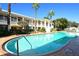 Relaxing resort-style pool with people enjoying the sun at 6440 Mourning Dove Dr # 403, Bradenton, FL 34210