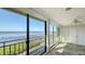 Sunroom with sliding doors showcasing waterfront views at 6440 Mourning Dove Dr # 403, Bradenton, FL 34210