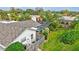 Aerial view showing backyard with pool, fenced area, and lush landscaping at 6609 Waterford Ln, Sarasota, FL 34238