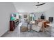 Light and airy living room with a modern aesthetic and a large TV at 6609 Waterford Ln, Sarasota, FL 34238