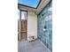 Outdoor shower with modern blue tile and a wooden bench at 6609 Waterford Ln, Sarasota, FL 34238