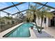 Enjoy this screened-in pool and spacious patio area at 6609 Waterford Ln, Sarasota, FL 34238