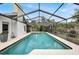 Inviting screened pool with ample deck space for lounging at 6609 Waterford Ln, Sarasota, FL 34238