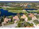 Community overview, showcasing upscale homes near a golf course and lake at 7123 Beechmont Ter, Lakewood Ranch, FL 34202