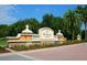 The Country Club at Lakewood Ranch entrance sign with palm trees at 7123 Beechmont Ter, Lakewood Ranch, FL 34202