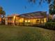 Back of house showcasing pool area and covered patio at 7123 Beechmont Ter, Lakewood Ranch, FL 34202