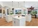 Spacious kitchen island with white cabinets and hardwood floors at 7123 Beechmont Ter, Lakewood Ranch, FL 34202