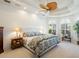 Main bedroom with a king-size bed and a ceiling fan at 7123 Beechmont Ter, Lakewood Ranch, FL 34202