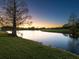 Peaceful pond view at sunset, showcasing serene landscape at 7123 Beechmont Ter, Lakewood Ranch, FL 34202