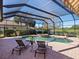 Inviting screened pool and patio area with lounge chairs at 7123 Beechmont Ter, Lakewood Ranch, FL 34202