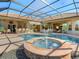 Inviting pool area with a fountain and covered patio, perfect for entertaining at 7123 Beechmont Ter, Lakewood Ranch, FL 34202