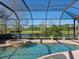 Relaxing pool and spa with a screened enclosure, overlooking a tranquil landscape at 7123 Beechmont Ter, Lakewood Ranch, FL 34202