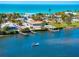 Aerial view of waterfront home near beach with boat at 725 N Manasota Key Rd # A, Englewood, FL 34223