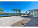 Spacious backyard with a patio, giving access to the waterfront at 725 N Manasota Key Rd # A, Englewood, FL 34223