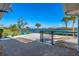 Spacious backyard with water views, paver patio, and fenced area at 725 N Manasota Key Rd # A, Englewood, FL 34223