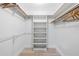 Bright white closet offers hanging and shelving storage at 725 N Manasota Key Rd # A, Englewood, FL 34223