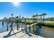 Wooden dock with boat lift and waterfront access at 725 N Manasota Key Rd # A, Englewood, FL 34223